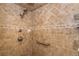 Shower with tile surround, grab bar, and handheld shower head at 10075 Bentley Ave, Englewood, FL 34224