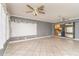 Bright sunroom offering ample natural light, tiled flooring, and access to the backyard and pool at 10075 Bentley Ave, Englewood, FL 34224
