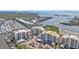Aerial view of condo buildings close to the water, surrounded by lush greenery and well-maintained landscaping at 13313 Gasparilla Rd # 404, Placida, FL 33946