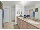 Bathroom with a double sink vanity, neutral color scheme and walk-in shower at 13313 Gasparilla Rd # 404, Placida, FL 33946