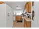 Bright kitchen features stainless steel appliances, wood cabinetry, and scenic views at 13313 Gasparilla Rd # 404, Placida, FL 33946