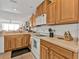 Bright kitchen features stainless steel appliances, wood cabinetry, and ample counter space at 13313 Gasparilla Rd # 404, Placida, FL 33946