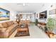 Living room featuring comfortable sofas, a coffee table and a television at 13313 Gasparilla Rd # 404, Placida, FL 33946