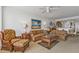 Living room featuring comfortable seating, decorative rug and beach-themed art at 13313 Gasparilla Rd # 404, Placida, FL 33946