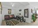 Versatile living space featuring a sofa bed, desk, and neutral decor at 13313 Gasparilla Rd # 404, Placida, FL 33946