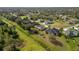 Aerial view showcasing the property in a well-established neighborhood with mature landscaping and green spaces at 1332 Hedgewood Cir, North Port, FL 34288