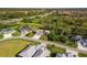 Aerial view of the property in a serene neighborhood with lush landscaping and a view of the surrounding community at 1332 Hedgewood Cir, North Port, FL 34288