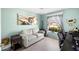 Comfortable bedroom with a serene ambiance, showcasing natural light and a ceiling fan at 1332 Hedgewood Cir, North Port, FL 34288