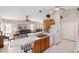 Kitchen and living area, highlighting breakfast bar, modern appliances, and comfortable seating at 1332 Hedgewood Cir, North Port, FL 34288
