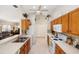 Functional kitchen featuring wooden cabinets and essential appliances at 1332 Hedgewood Cir, North Port, FL 34288