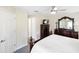 Cozy main bedroom with TV and a closet, complemented by neutral tones and soft lighting at 1332 Hedgewood Cir, North Port, FL 34288