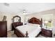Beautiful main bedroom with elegant furniture, a ceiling fan, and plenty of natural light at 1332 Hedgewood Cir, North Port, FL 34288