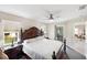 Serene main bedroom offers ample natural light and private access to screened lanai and backyard at 1332 Hedgewood Cir, North Port, FL 34288