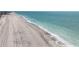 Beautiful aerial view of the coastline featuring crystal clear turquoise water and sandy beach at 1410 Beach Rd # 201, Englewood, FL 34223