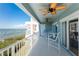 Balcony with patio furniture overlooking beautiful water views at 1410 Beach Rd # 201, Englewood, FL 34223