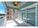 View of balcony with white railing and sliding glass doors at 1410 Beach Rd # 201, Englewood, FL 34223