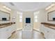 Bathroom featuring a soaking tub flanked by two separate walk-in showers at 1410 Beach Rd # 201, Englewood, FL 34223