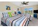 Bedroom featuring two beds, ceiling fan, and views of outside scenery at 1410 Beach Rd # 201, Englewood, FL 34223