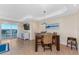 Dining room with water views, tile floors, and cozy seating area with table and chairs at 1410 Beach Rd # 201, Englewood, FL 34223