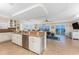 Spacious kitchen island with granite countertops and stainless steel appliances overlooking waterfront at 1410 Beach Rd # 201, Englewood, FL 34223
