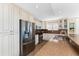 Well-equipped kitchen with stainless steel appliances, granite counters, and ample cabinet space at 1410 Beach Rd # 201, Englewood, FL 34223