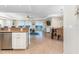 Open concept living area with tiled floors and views at 1410 Beach Rd # 201, Englewood, FL 34223