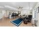 Open-concept living space with bar seating and natural light at 1410 Beach Rd # 201, Englewood, FL 34223