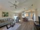 Open-concept living space with a ceiling fan and view of the dining area at 14244 Spruce Ln, Port Charlotte, FL 33953