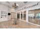 The Riverwood clubhouse interior features a decorative table, hardwood floors, and view of the library at 14290 Reserve Ct, Port Charlotte, FL 33953