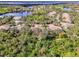 Beautiful aerial view showcasing a neighborhood with mature trees and a nearby golf course at 14298 Reserve Ct, Port Charlotte, FL 33953