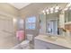 Bright bathroom featuring shower, toilet, and vanity at 14298 Reserve Ct, Port Charlotte, FL 33953