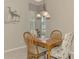 Cozy dining area with wood table and chairs and decorative lighting at 14298 Reserve Ct, Port Charlotte, FL 33953
