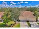 Beautiful single-Gathering home with a well-manicured lawn, mature trees, and a two-car garage at 14298 Reserve Ct, Port Charlotte, FL 33953