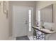 Inviting entryway features a tiled floor, front door, and a mirrored accent wall at 14298 Reserve Ct, Port Charlotte, FL 33953