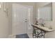Warm and inviting foyer with a decorative table, mirror, and tiled flooring at 14298 Reserve Ct, Port Charlotte, FL 33953