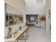Bright foyer leading to the living area and kitchen, showcasing an open floor plan at 14298 Reserve Ct, Port Charlotte, FL 33953