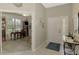 Open foyer with tile flooring, a view of the office, and a decorative table at 14298 Reserve Ct, Port Charlotte, FL 33953