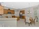 Kitchen with stainless steel appliances and adjacent dining area at 14298 Reserve Ct, Port Charlotte, FL 33953
