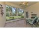 Enclosed lanai featuring seating and views of backyard at 14298 Reserve Ct, Port Charlotte, FL 33953