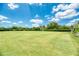 Manicured lawn bowling greens featuring short, manicured grass and perimeter seating at 14298 Reserve Ct, Port Charlotte, FL 33953