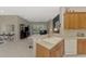 Open floor plan featuring kitchen, living room, and screened in lanai at 14298 Reserve Ct, Port Charlotte, FL 33953