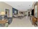 Open concept living room features tile flooring and access to other rooms at 14298 Reserve Ct, Port Charlotte, FL 33953