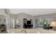 Spacious living area with sliding glass doors offering scenic views and lots of natural light at 14298 Reserve Ct, Port Charlotte, FL 33953