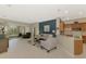 Open-concept living room and kitchen area with plenty of natural light and tile flooring at 14298 Reserve Ct, Port Charlotte, FL 33953