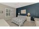 Comfortable bedroom with a accent wall, natural light, and carpeted floors at 14298 Reserve Ct, Port Charlotte, FL 33953