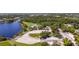 Aerial view of waterfront community park featuring picnic area, playground, and boat dock at 14382 Lillian Cir, Port Charlotte, FL 33981