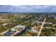 Wide aerial shot of a residential area featuring waterfront properties and canals at 14382 Lillian Cir, Port Charlotte, FL 33981