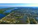 Expansive aerial view showcasing the coastal community's layout with canals, waterways, and neighborhood design at 14382 Lillian Cir, Port Charlotte, FL 33981