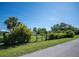A spacious backyard with a well manicured lawn and black chain link fence at 14382 Lillian Cir, Port Charlotte, FL 33981