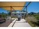 Open-air backyard patio with seating and bar area, ideal for outdoor gatherings at 14382 Lillian Cir, Port Charlotte, FL 33981